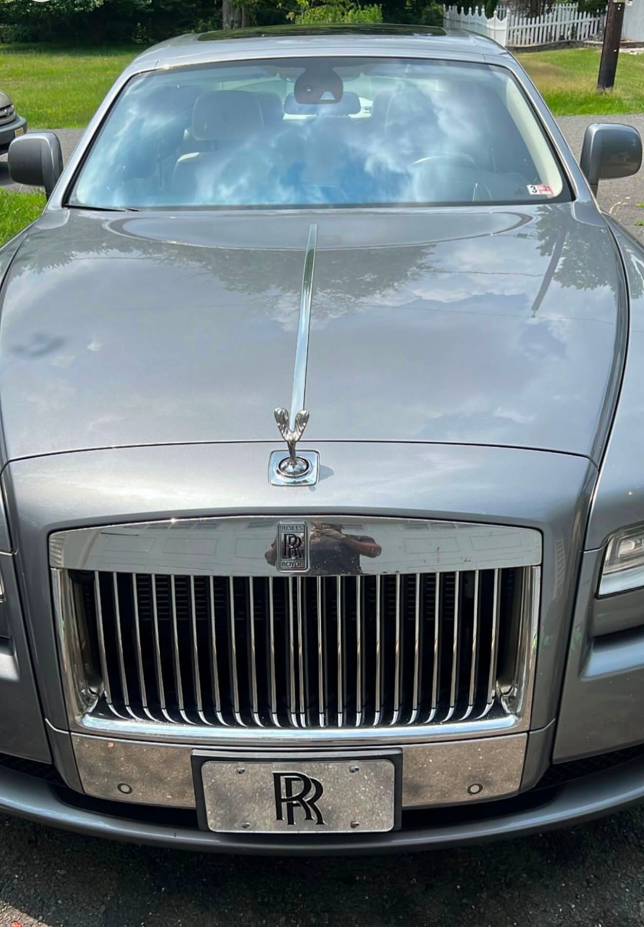 A Rolls-Royce Ghost parked outside at BMW Experts LLC